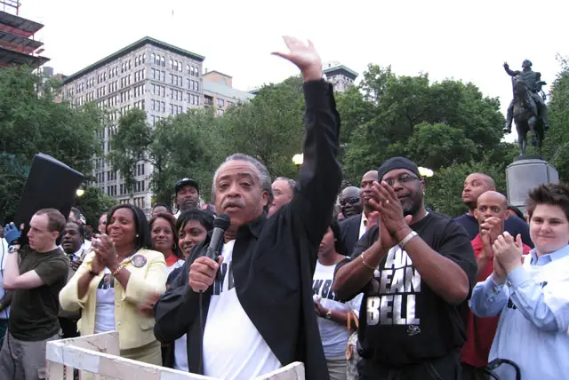Reverend Al Sharpton rallies the crowd.  To his right, is William Bell, Sean Bell's father.